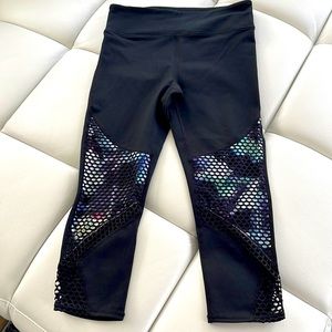 Fabletics size Small black leggings with multicolored trim and mesh.